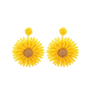 Detailed view of handmade raffia flower earrings featuring yellow petals and a brown center