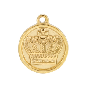 Close-up of golden round pendant with embossed crown pattern and polished metal finish