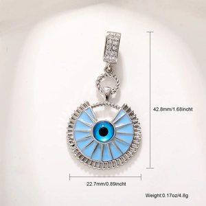 Detail view of blue enamel evil eye pendant with size measurements and weight info
