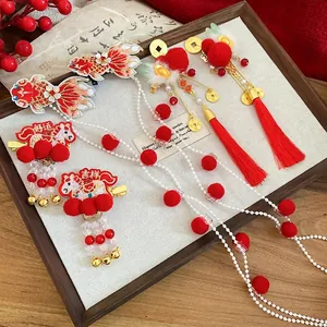Traditional Chinese New Year hair clips set with koi embroidery and lucky red pom poms