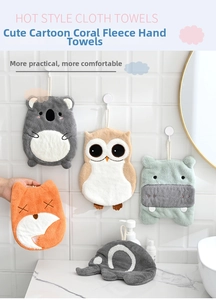 Detail of coral fleece hand towels with cute animal designs and hanging loops for kitchen use