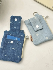 Blue denim card holder wallet with star and bow patterns featuring zipper and snap button