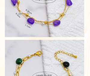 Macro detail of gold-plated bracelets showing adjustable lobster clasp and charms