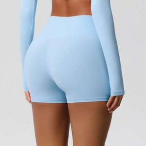 Detail view of high-waisted lifting yoga shorts in light blue with seamless fit