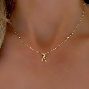 Chic gold stainless steel beaded chain necklace featuring a minimalist letter K pendant