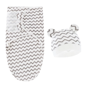 Detail of white newborn swaddle wrap and hat set with grey chevron and bear ear details