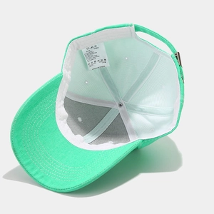Light green cotton baseball cap showing internal lining and adjustable metal buckle