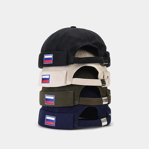 Detail of cotton docker hats showing Russian flag patch and metal adjustable buckles