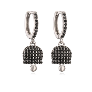 Macro shot of silver bell drop earrings with pavé set black cubic zirconia stones