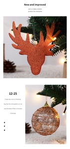 Close-up of brown glitter deer and hollow ball ornaments on a festive Christmas tree branch