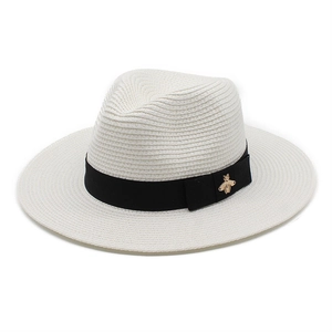 White straw Panama sun hat for men with black ribbon and gold bee emblem
