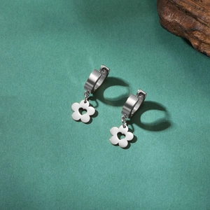 Detail view of silver heart flower hoop earrings made of polished stainless steel