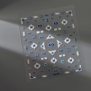 Detail of ethnic 5D evil eye nail stickers with blue heart and butterfly patterns
