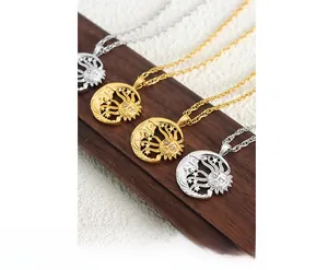 Detail of vintage sun and moon pendant necklaces with rhinestone accents in gold and silver