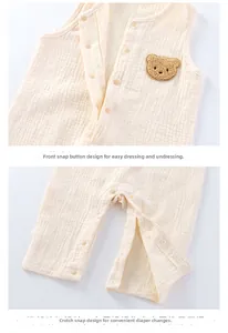 Close-up of cotton gauze baby romper showing fabric texture and bear embroidery