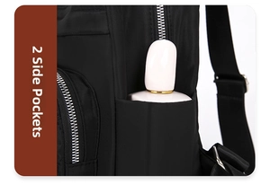 Sac à dos matelassé en nylon noir détail de poche latérale avec fermeture éclair robuste.