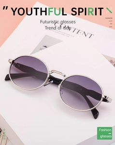 Detail view of oval silver metal sunglasses with purple gradient lenses and fine hinges
