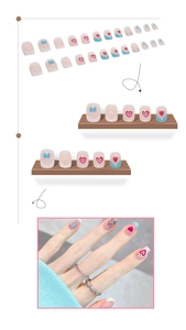 Detail view of pink and blue gradient press-on nails with 3D hearts and bow accents