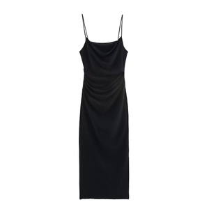 Detail of black satin midi dress featuring delicate spaghetti straps and ruched texture