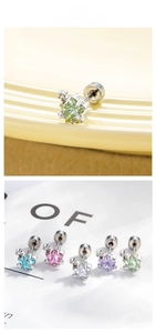 Macro shot of colorful star zircon stud earrings with five-color set in silver finish