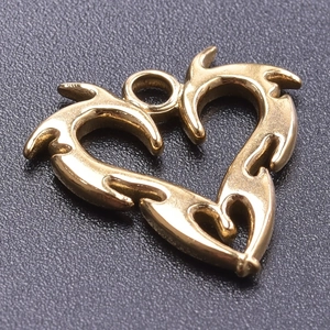 Macro shot of gold-plated 18k stainless steel heart pendant with fluid hollow-out design