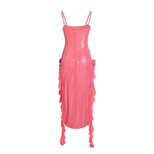 Detail of pink sequin dress with side ruffles and back zipper closure on white background