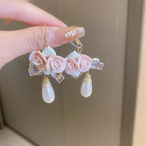 Pink floral droplet earrings with pearl pendants and iridescent bow for women