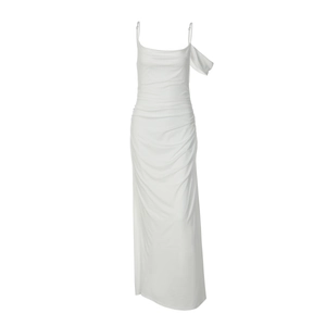 Detail of white backless maxi dress featuring elegant side ruching and draped fabric