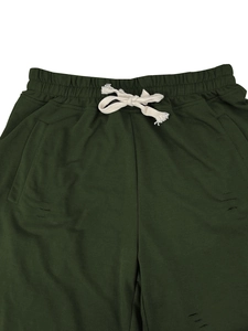 Detail of dark green casual shorts featuring elastic drawstring waist and distressed accents
