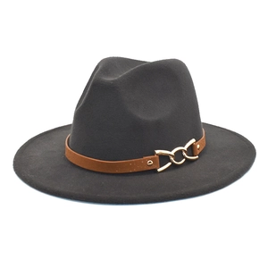 Detail view of wide-brim felt fedora hat with brown leather strap and gold chain