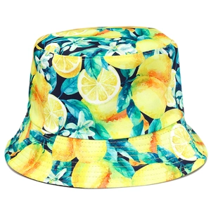 Reversible bucket hat featuring vibrant lemon and floral prints on a dark blue background
