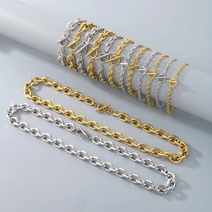 Detailed macro view of assorted gold and silver stainless steel O-chains with toggle clasps