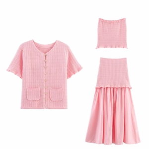 Three-piece pink knit set featuring waffle texture cardigan, bandeau top, and maxi skirt