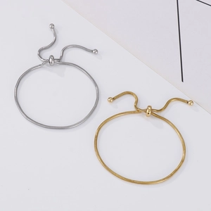 Detail of adjustable gold and silver snake chain bracelets with sliding metal toggles