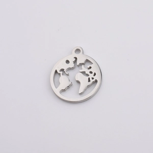 Detailed macro view of silver hollowed-out world map pendant in polished stainless steel