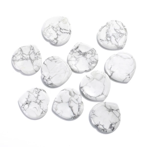 Detailed top view of heart shaped white marble worry stones with natural polished texture