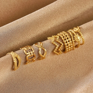 Bohemian gold geometry ring set with infinity sun and moon designs on silk fabric