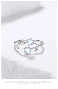 Detail of 925 silver vine ring with light blue moonstones and sparkling zircon leaves