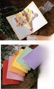 3D pop-up greeting card featuring detailed tulip floral paper carving and colorful covers