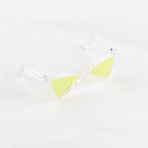 Macro shot of stylish cat eye sunglasses with yellow lenses and clear frames for small pets