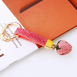 Sparkling pink rhinestone strawberry keychain with golden alloy ring for bags