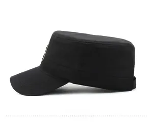 Side view of black flat top military cadet hat with circular badge and reinforced stitching