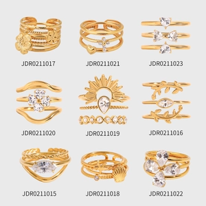 Set of minimalist layered stainless steel rings for women with gold plating and zircons
