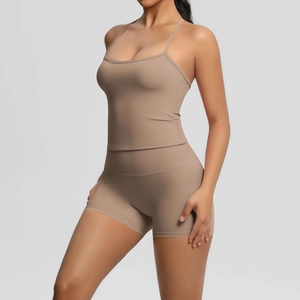 Detail of soft brushed fabric texture on high-waist seamless yoga shorts and tank top