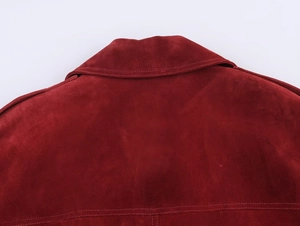 Close-up of red suede jacket collar and back showing fine texture and neat stitching