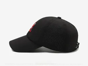 Detailed side view of black quick-dry baseball cap featuring breathable vents and red embroidery