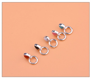 Close-up of five S925 heart charms in red, black, white, pink and blue enamel