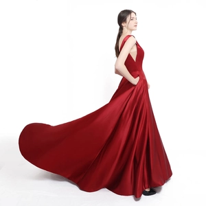 Elegant deep red satin evening gown featuring a sexy V-neck side cut and flared floor-length skirt