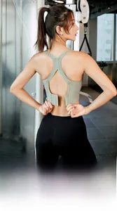 Detailed back view of light green sports bra with cross straps and adjustable buckle