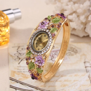 Elegant gold bangle watch with purple floral enamel patterns and inlaid rhinestones